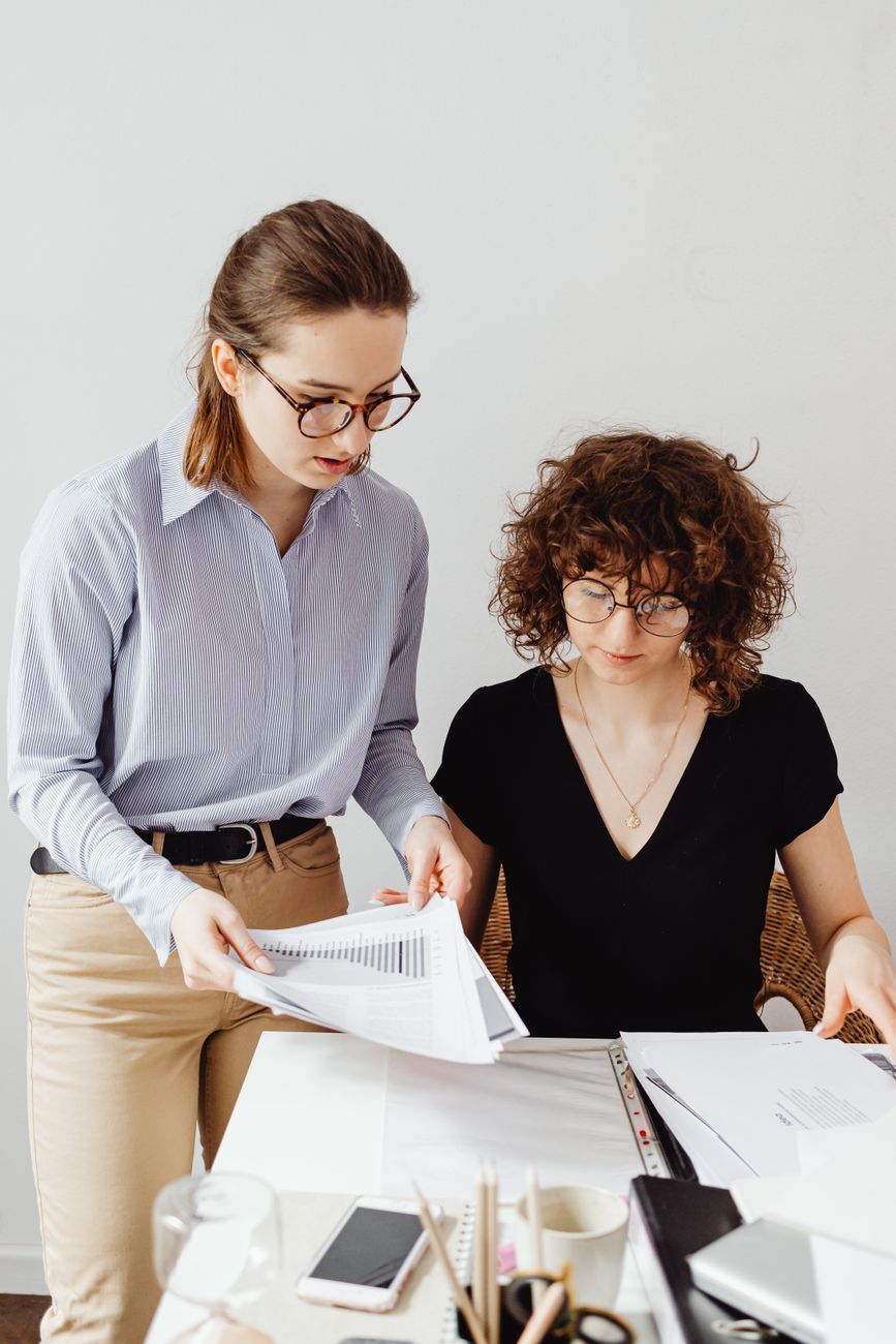 Modern financial services advisor assessing records